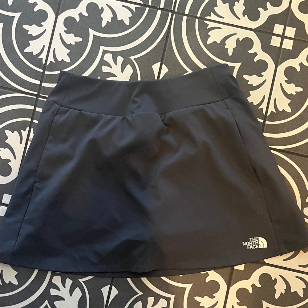 The North Face grey Skirt with built in shorts. Size 10/12 girls. Never worn